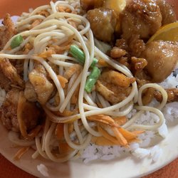 Dragón Dorado - Bed of rice with half an order of "spaghetti" (their name for chow mein) and orange chicken.