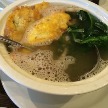 Fugu - Yep. This is what they call "Tamato Egg Drop Soup". More like fried egg, hideous spinach, and salty water. - Asian Fusion Near Me - Madison, Wisconsin