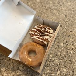 Duck Donuts - One Glazed and one maple icing topped with bacon and a marshmallow drizzle