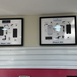Wall-mounted decorative frames showcasing internal layouts of popular devices, enhancing our tech-focused environment.