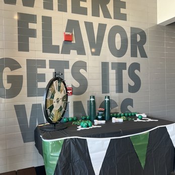 Wingstop - a table with a black tablecloth and a clock - Chicken Wings Near Me - Upland, California