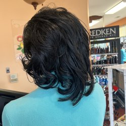 Loretta's Hair Boutique - Ms Loretta has magical fingers! She transformed my daughters natural hair into this beautiful silk press! All natural! Blessed hands!