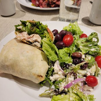 Main St. Local Kitchen - Roasted chicken wrap woth a side of very good Greek salad - Burgers Near Me - Huntsville, Ontario Main St. Local Kitchen - Roasted chicken wrap woth a side of very good Greek salad - Burgers Near Me - Huntsville, Ontario