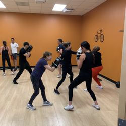 Anytime Fitness - Members pairing up to practice their new boxing skills.