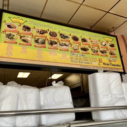 menu on the wall but they also have a hot bar with different stews menu on the wall but they also have a hot bar with different stews