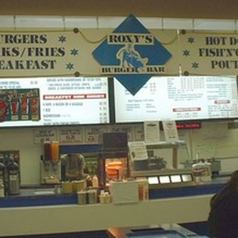 Roxy's Burger Bar - a woman sitting at the counter - Fast Food Near Me - Calgary, Alberta Roxy's Burger Bar - a woman sitting at the counter - Fast Food Near Me - Calgary, Alberta