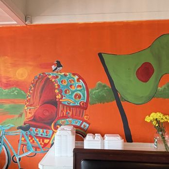 Dhansiri - Jatiyo Sriti Shoudho (The National Martyrs' Memorial), rickshaw, and Bangladesh's flag. - Coffee & Tea Near Me - Norcross, Georgia Dhansiri - Jatiyo Sriti Shoudho (The National Martyrs' Memorial), rickshaw, and Bangladesh's flag. - Coffee & Tea Near Me - Norcross, Georgia