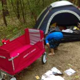 Son using his wagon at camp site