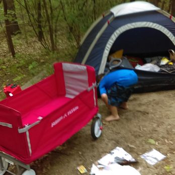 Dunewood Camp Ground - Son using his wagon at camp site - Campgrounds Near Me