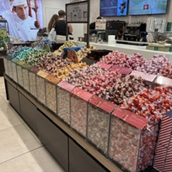 The Florida Mall - Lindt chocolates. Just a small portion of what's available. There's another section and the walls are covered in selections. Mind boggling. - Shopping Centers Near Me - Orlando, Florida