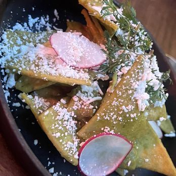 Tán by Chef Richard Sandoval - Chilaquiles : green tomatillo sauce, crema, onion, queso fresco, sesame seed - Latin American Near Me - New York, New York Tán by Chef Richard Sandoval - Chilaquiles : green tomatillo sauce, crema, onion, queso fresco, sesame seed - Latin American Near Me - New York, New York