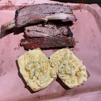 Terry Black's Barbecue - 1/2 lb Beef Rib (top), 1/2 lb Brisket (middle), 1 Pork Rib (bottom) with the Mac and Cheese side. - Barbeque Near Me - Austin, Texas Terry Black's Barbecue - 1/2 lb Beef Rib (top), 1/2 lb Brisket (middle), 1 Pork Rib (bottom) with the Mac and Cheese side. - Barbeque Near Me - Austin, Texas