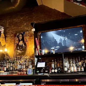 Graffiti Pasta - a bar with a television and a bar counter - Italian Near Me - Denton, Texas