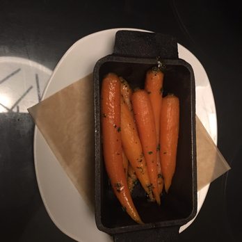Table 19 - A definite get, honey glazed carrots warmed in a Lodge pan, a light way to start a meal here... - New American Near Me - Peoria, Illinois