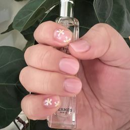 Gel manicure with hand painted flowers. Gel manicure with hand painted flowers.