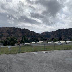 Side view of the runway, past the fence and before the buildings.