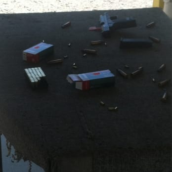 Knob Creek Gun Range - My station. A 9mm Springfield and a bunch of spent ammo - Gun/Rifle Ranges Near Me - West Point, Kentucky