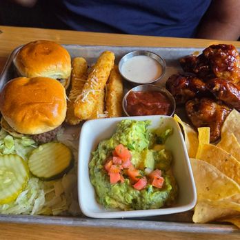 BJ's Restaurant & Brewhouse - Brewhouse bites sampler. With guacamole dip, with honey barbq bone in wings - Pizza Near Me - New Braunfels, Texas BJ's Restaurant & Brewhouse - Brewhouse bites sampler. With guacamole dip, with honey barbq bone in wings - Pizza Near Me - New Braunfels, Texas