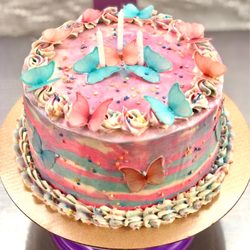 Raquel Confections - "Butterfly Fantasy" Vanilla Buttercream, edible butterflies on a vanilla funfetti strawberry filled cake.