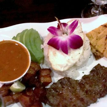 Tainos Cafe & Lounge - Bandeja Paisa - Colombian Platter: L to R: beans, avocado, rice topped w/ egg, sweet corn cake, pork cracklings, steak - Latin American Near Me - Coram, New York Tainos Cafe & Lounge - Bandeja Paisa - Colombian Platter: L to R: beans, avocado, rice topped w/ egg, sweet corn cake, pork cracklings, steak - Latin American Near Me - Coram, New York