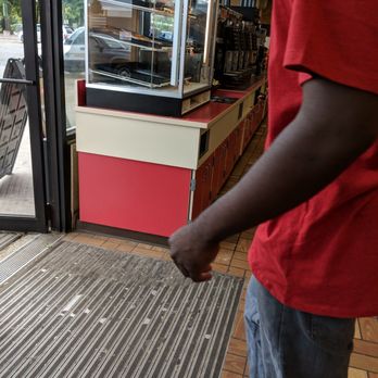 Fastrac - a man standing in front of a store - Convenience Stores Near Me - Rochester, New York