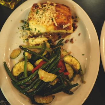 Demitris Taverna - mousaka - layers of eggplant, ground meat, and potatoes, baked in a parmesan bechamel sauce - Greek Near Me - Livermore, California Demitris Taverna - mousaka - layers of eggplant, ground meat, and potatoes, baked in a parmesan bechamel sauce - Greek Near Me - Livermore, California