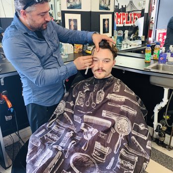 Amplify Barber Shop - Eli using straight razor on the lines - Barbers Near Me - Berkeley, California