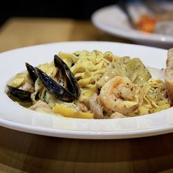 West First Wood-Fired - Entree Special:  Seafood Pasta (House-made Fettuccine / Shrimp / Mussels / Tile Fish / Artichokes)