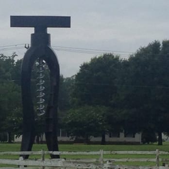 The Dog And Oyster Micro-Vineyard - The entrance is marked by 2 giant cork screws. - Wineries Near Me - Irvington, Virginia