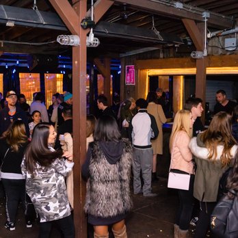 The Ginn Mill - a large group of people standing around - Pubs Near Me - Denver, Colorado