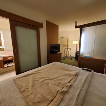 SpringHill Suites by Marriott Lumberton - King bed from another angle - horrible TV placement! - Hotels Near Me - Lumberton, North Carolina