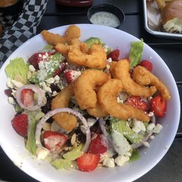 Strawberry salad with fried shrimp.  Very large and deep bowl
