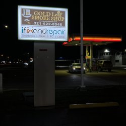 Gold Leaf Smoke Shop - Marquee sign shows next to Shell gas station.