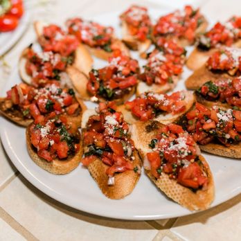 FIRED Pizza - a plate of crostini with tomatoes - Pizza Near Me - Stockton, California FIRED Pizza - a plate of crostini with tomatoes - Pizza Near Me - Stockton, California