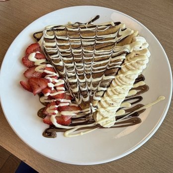 Crepeccino - Sweet Belgium crêpe  It has Belgium, white chocolate, and chocolate. With diced strawberries and bananas. - Coffee & Tea Near Me - San Antonio, Texas