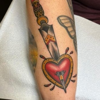 Black Lotus Tattooers - Heart and dagger flash piece drawn and tattooed by Aarin - Tattoo Near Me - Gilbert, Arizona