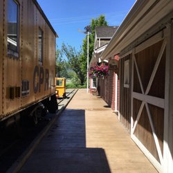 Agassiz-Harrison Museum - Old rail car, boardwalk in front of Museum.