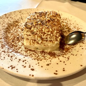 Cafe Milano - a dessert on a plate with a spoon - Italian Near Me - San Diego, California