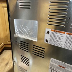 Lowe's Home Improvement - The damage we found today while getting the serial number for our warranty call