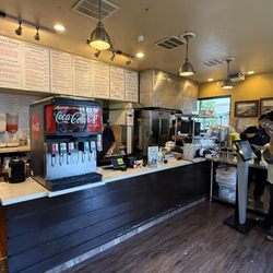 Benny's Tacos & Rotisserie Chicken - Front counter and menu