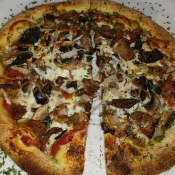 Saint Pizza - The Wild Mushroom: Fresh tomato sauce, olive oil, mushrooms, shiitakes, porcinis, morels, chanterelles, garlic, onions, mozzarella. 14$ - Pizza Near Me - Montreal, Quebec Saint Pizza - The Wild Mushroom: Fresh tomato sauce, olive oil, mushrooms, shiitakes, porcinis, morels, chanterelles, garlic, onions, mozzarella. 14$ - Pizza Near Me - Montreal, Quebec