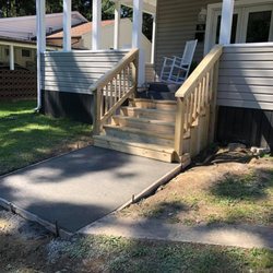 CAT Trucking and Excavation - New sidewalk and steps for customer.