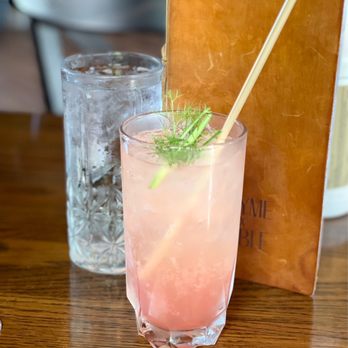 Thyme Table - a pink drink with a straw in a glass - New American Near Me - Bay Village, Ohio Thyme Table - a pink drink with a straw in a glass - New American Near Me - Bay Village, Ohio