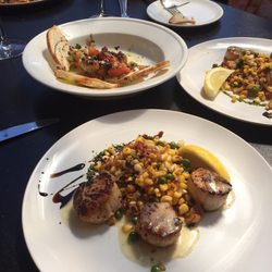 Scallops with sautéed corn.