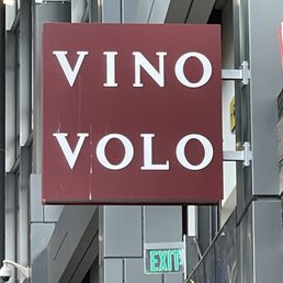 a sign for a wine shop a sign for a wine shop