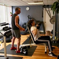 Titanium Health & Fitness - John works with clients to meet their individualized needs.