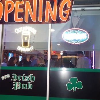 The Irish Pub - a neon sign in the window - Barbeque Near Me - Baldwin, New York