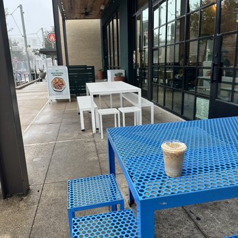 Houndstooth Coffee - Outdoor seating area shared with Sweetgreen next door. - Coffee & Tea Near Me - Austin, Texas