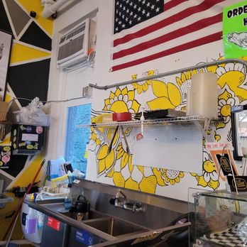 Villon Coffee - The decorative flowers on the wall above the sink. - Coffee & Tea Near Me - Melbourne, Florida