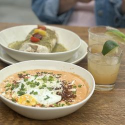 CHORIZO GRAVY (brunch menu) crispy corn cakes, creamy chorizo gravy, scallions, queso fresco, two sunny eggs Serrano peach margarita